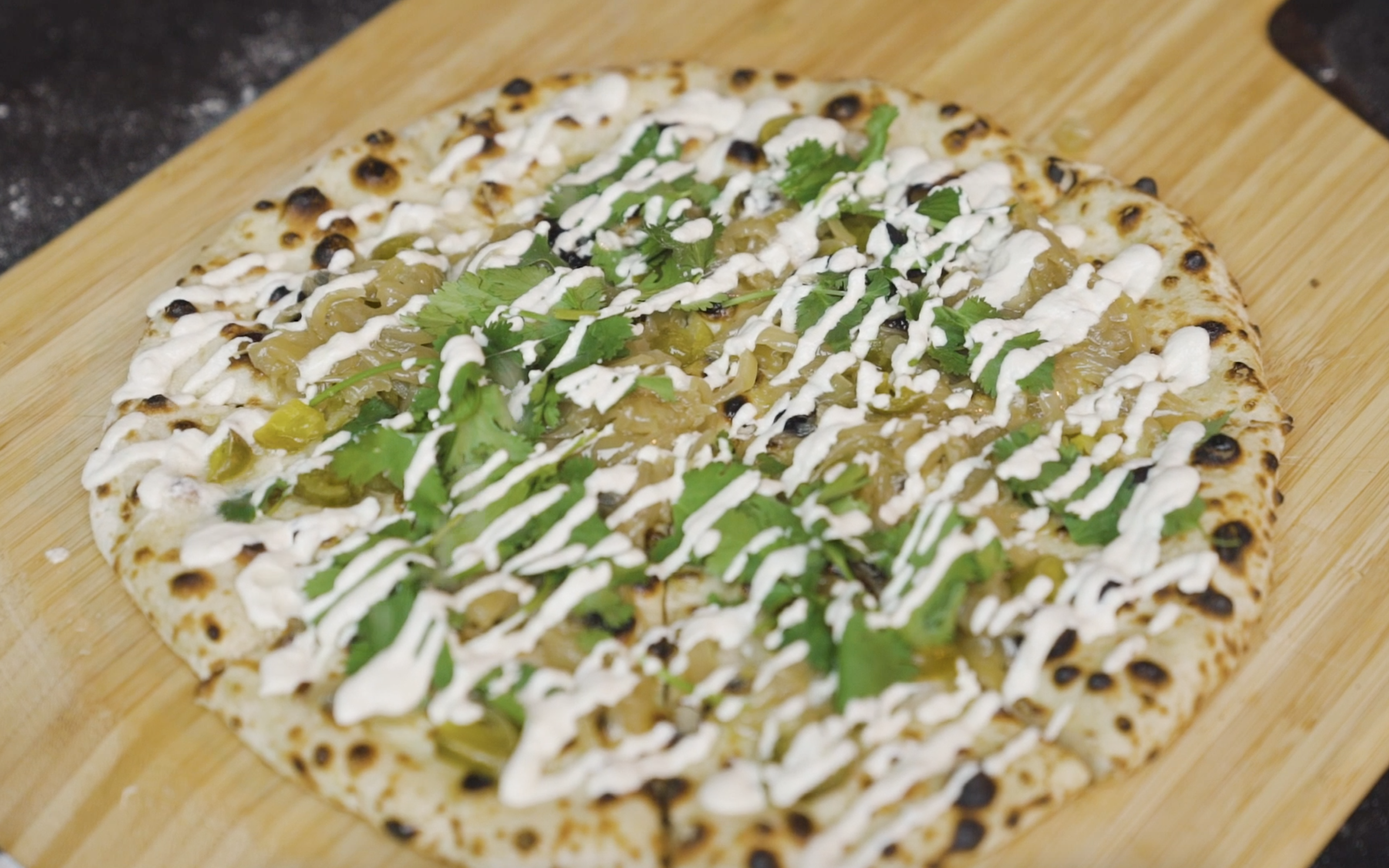 Pickled Jalapeño, Caramelised Onion & Garlic Cashew Cream Pizza — Ooni Canada