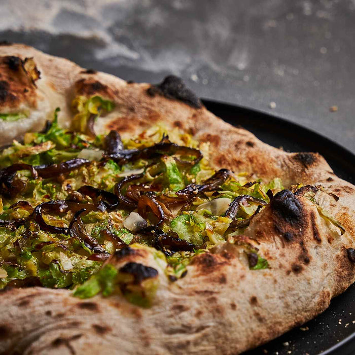 German Brussels Sprouts Pizza with Blue Cheese, Onions and Almonds