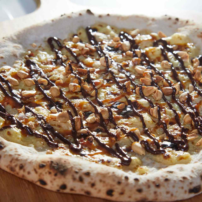 Chocolate, Caramel and Peanut Candy Bar Pizza