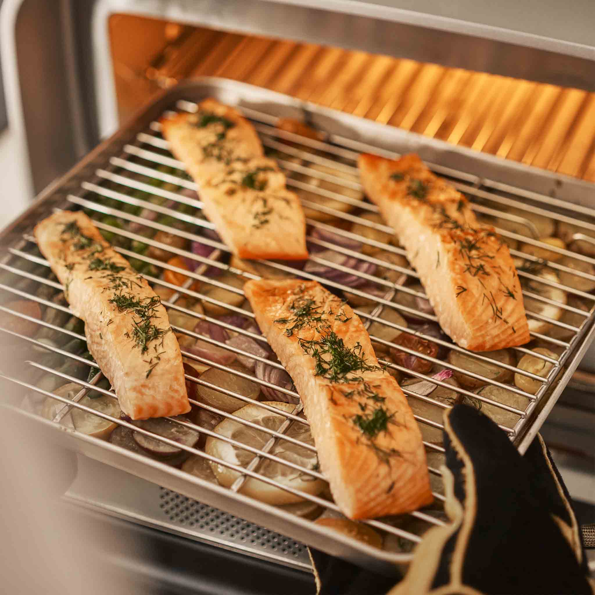 Cooked salmon filets on Ooni Sheet Pan. 