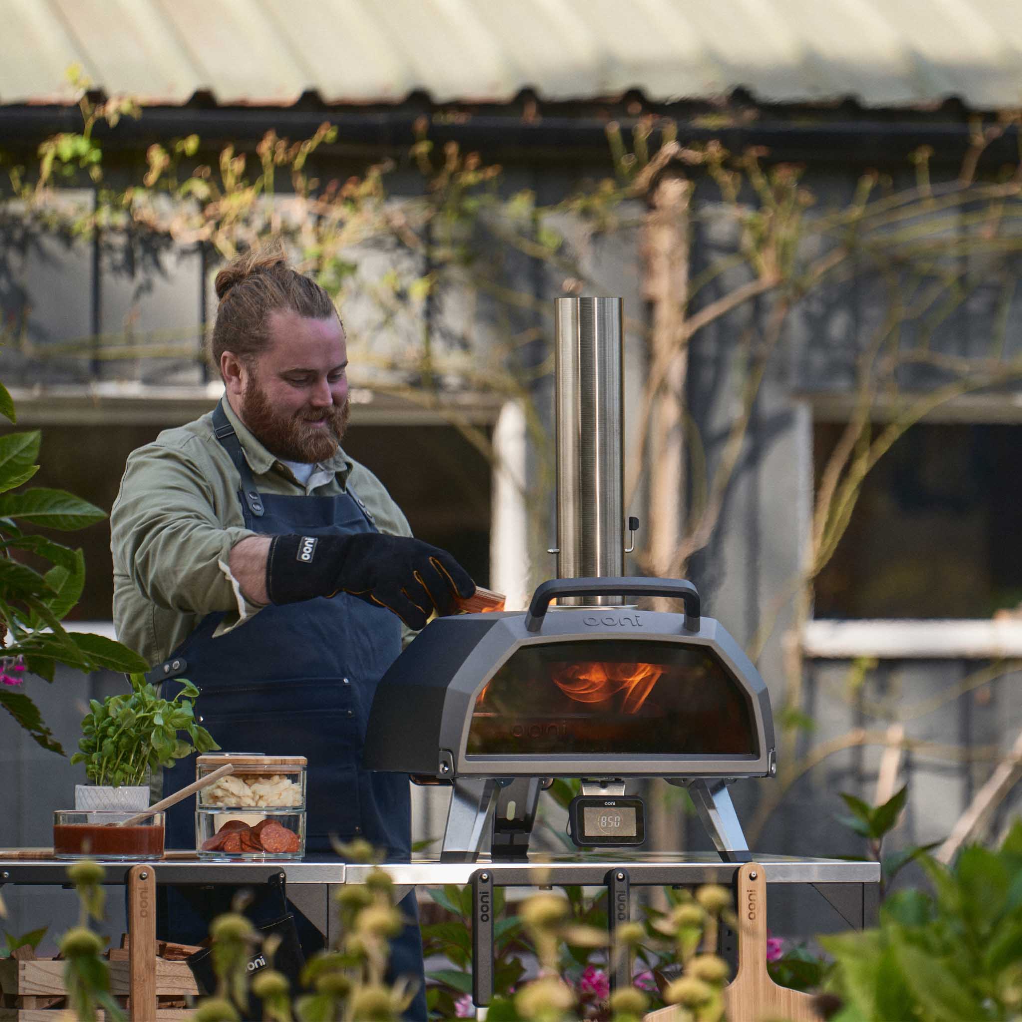Loading wood fuel into Ooni Karu 2 Pro Multi-Fuel Pizza Oven 