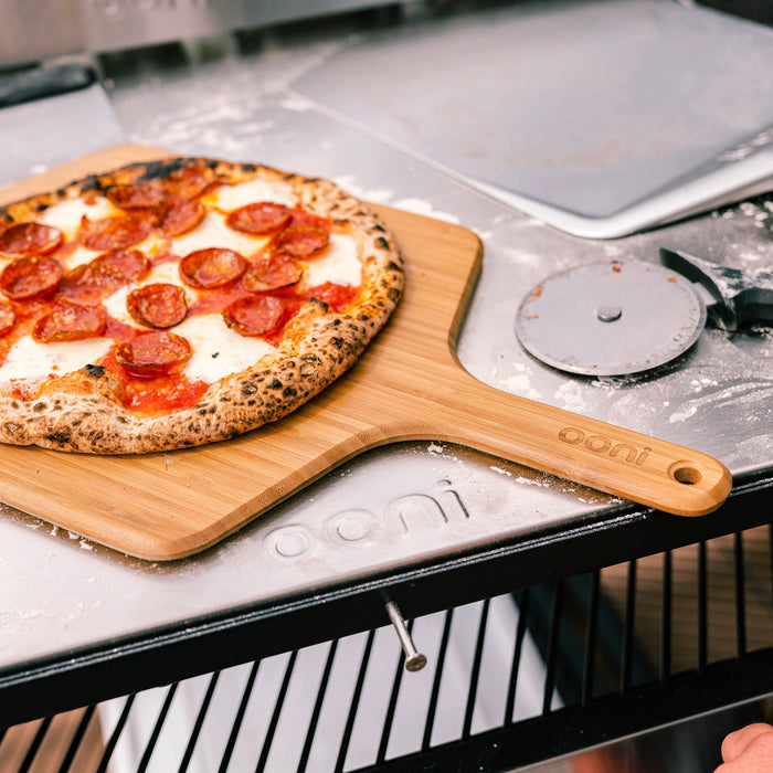 Ooni 12″ Bamboo Pizza Peel & Serving Board | Click this image to open up the product gallery modal. The product gallery modal allows the images to be zoomed in on.