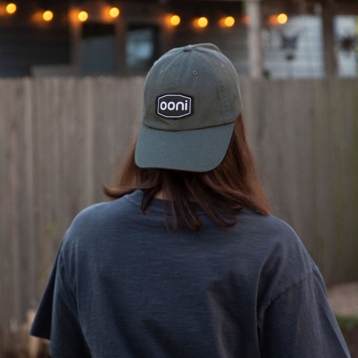Ooni Badge Grey Dad Hat Lifestyle Shot Back | Click this image to open up the product gallery modal. The product gallery modal allows the images to be zoomed in on.